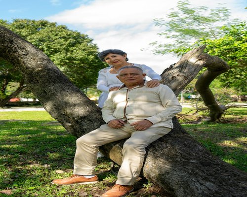 Active senior couple smiling in park environment