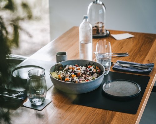 Fresh salad and healthy vegetables on a wooden table